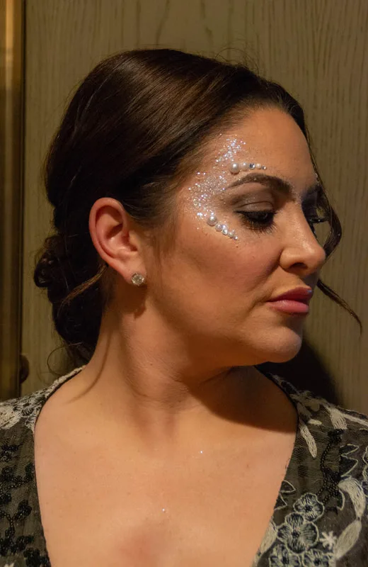 A woman in Tiburon, California, wearing a hand made jewel cluster from the Bling Bar
