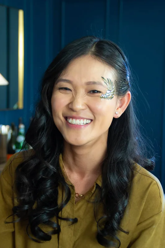 A woman in Oakland, California, wearing a hand made jewel cluster from the Bling Bar