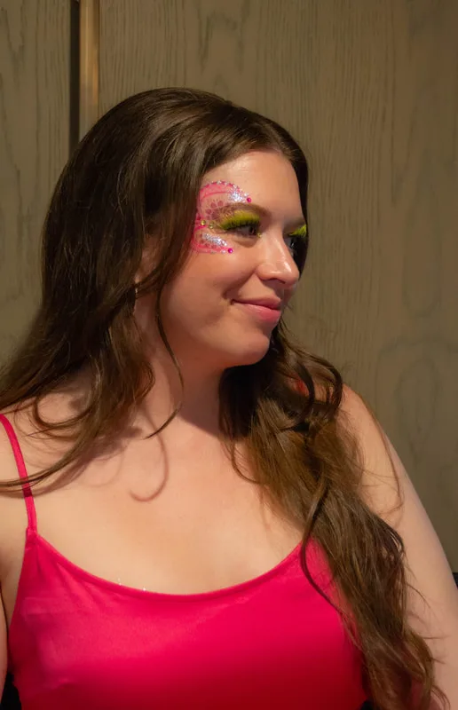 A woman in Berkeley, California, wearing a hand made jewel cluster from the Bling Bar