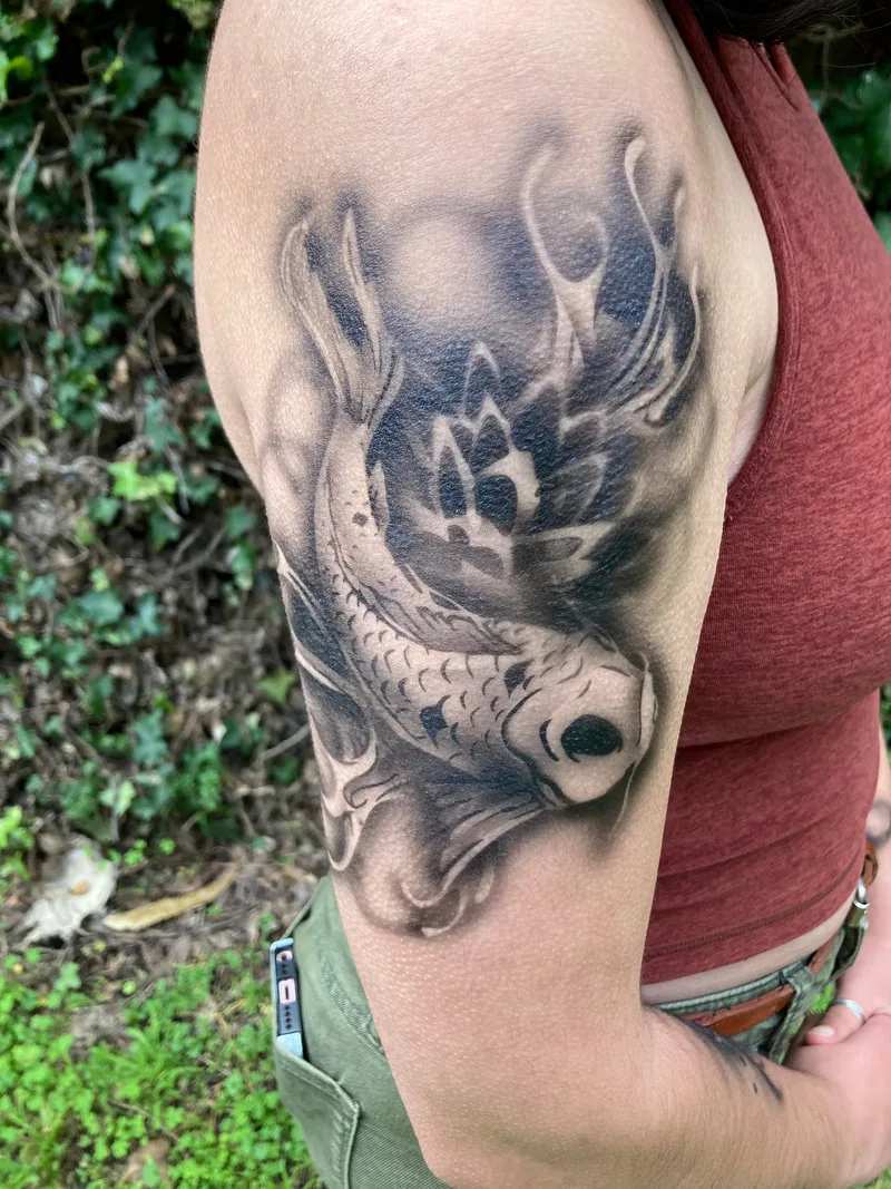 A person's arm with a realistic koi fish in the San Francisco Bay Area