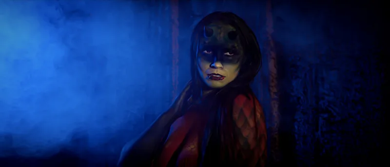 A young woman body painted as a red and yellow dragon stands in a cloud of blue smoke, Oakland, Ca